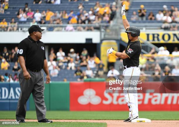 Jose Osuna of the Pittsburgh Pirates reacts after hitting an RBI double to right field in the fifth inning during the game against the Arizona...