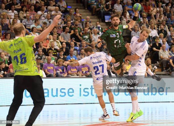 Matthias Puhle, Kevin Schmidt of VfL Gummersbach, Fabian Wiede of Fuechse Berlin and Julius Kuehn of VfL Gummersbach during the game between Fuechse...