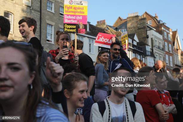 Party supporters hold placards ahead of the BBC Leaders Debate on May 31, 2017 in Cambridge, England. Six Leaders of the Seven political parties...