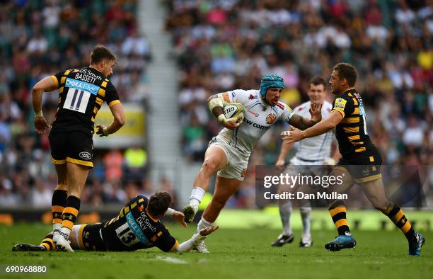 Jack Nowell of Exeter Chiefs is tackled by Elliot Daly and Jimmy Gopperth of Wasps during the Aviva Premiership Final between Wasps and Exeter Chiefs...