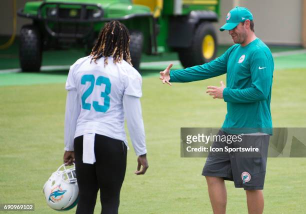Miami Dolphins Head Coach Adam Gase talks with Miami Dolphins Running Back Jay Ajayi during a practice session at the Miami Dolphins training camp on...