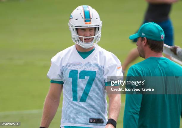 Miami Dolphins Quarterback Ryan Tannehill talks with Miami Dolphins Head Coach Adam Gase during a practice session at the Miami Dolphins training...