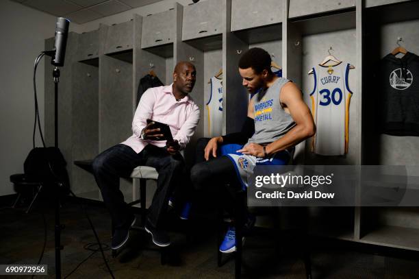 Legend Gary Payton chats with Stephen Curry of the Golden State Warriors during Facebook Live at practice and media availability as part of the 2017...