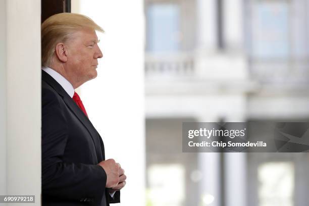 President Donald Trump watches as Vietnamese Prime Minister Nguyen Xuan Phuc leaves the White House following meetings May 31, 2017 in Washington,...