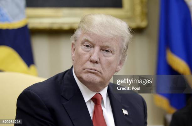 USPresident Donald Trump looks on during a meeting with Prime Minister Nguyen Xuan Phuc of Vietnam in the Oval Office of the White House, on May 31,...