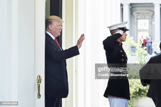 President Donald Trump, waves as Nguyen Xuan Phuc, Vietnam's prime minister, not pictured, departs after a meeting at the West Wing of the White...