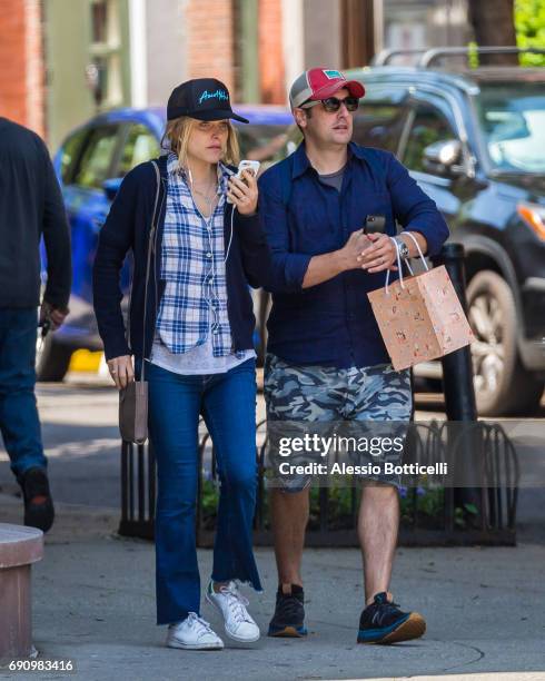 Jason Biggs and wife Jenny Mollen are seen walking in West Village after having breakfast at Sant Ambroeus on May 31, 2017 in New York City.