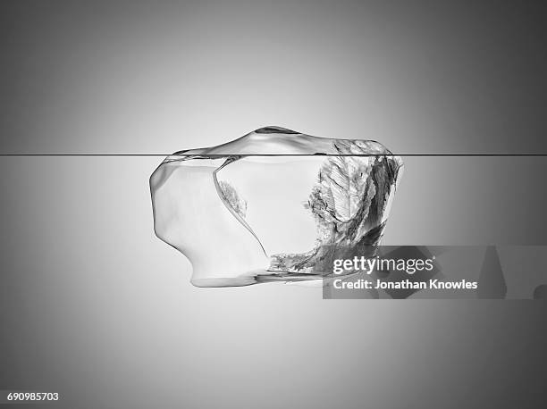 melting iceberg - iceberg stock pictures, royalty-free photos & images