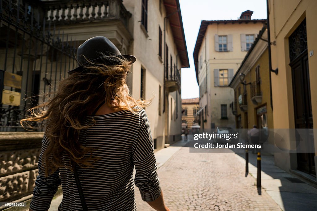 A woman walking the streets of Italy