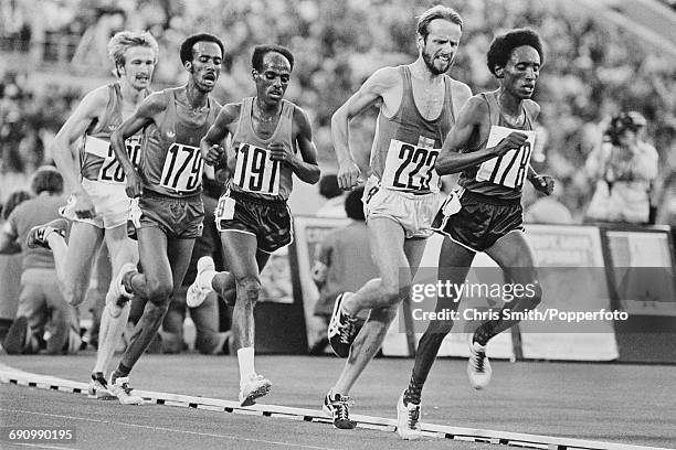 View of competition in the final of the Men's 10,000 metres event with from left, silver medallist Kaarlo Maaninka of Finland , Tolossa Kotu of...