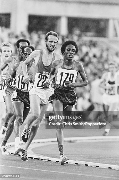 View of competition in the final of the Men's 10,000 metres event with from left, Tolossa Kotu of Ethiopia , gold medallist Miruts Yifter of Ethiopia...