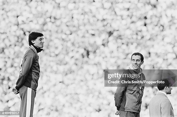 Gold medallist track athlete Sebastian Coe and bronze medallist Steve Ovett, both of the Great Britain team pictured together on the medal podium...