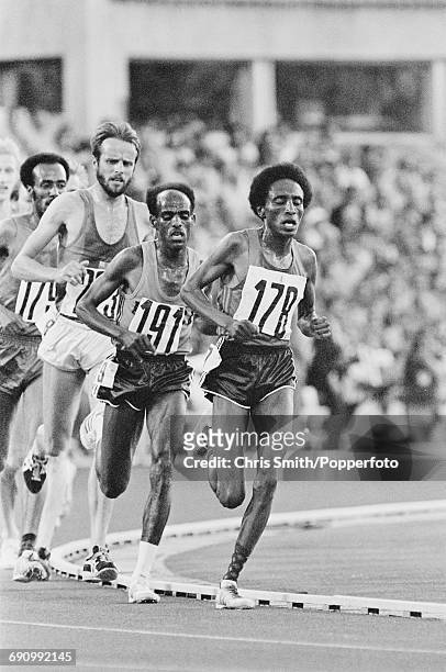 View of competition in the final of the Men's 10,000 metres event with from left, Tolossa Kotu of Ethiopia , Lasse Viren of Finland , gold medallist...