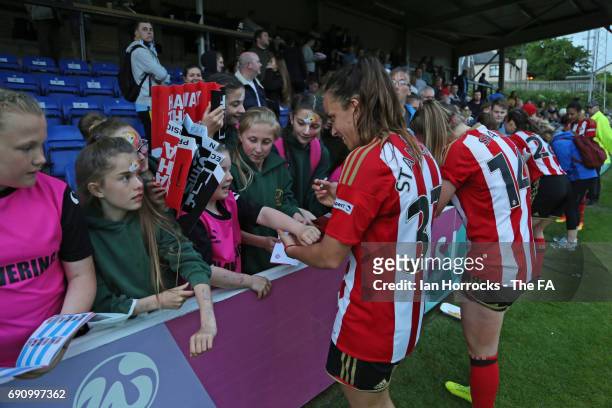 Sunderland players sign autographs after the final whistle during the FA WSL Spring Series match between Sunderland AFC Ladies and Manchester City...