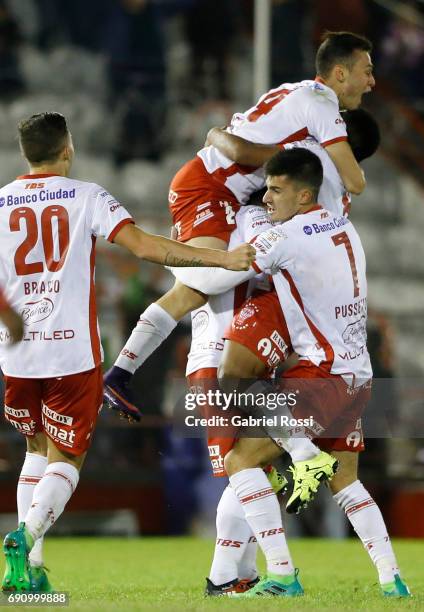 Leandro Cuomo of Huracan and teammates celebrate their team's third goal during a second leg match between Huracan and Deportivo Anzoategui as part...