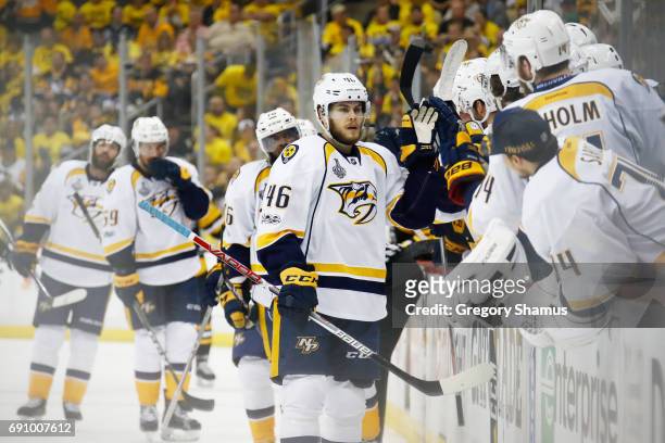 Pontus Aberg of the Nashville Predators celebrates with teammates on the bench after scoring a goal during the first period in Game Two of the 2017...