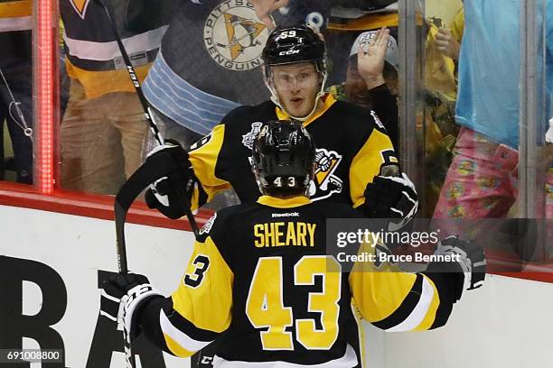 Jake Guentzel of the Pittsburgh Penguins celebrates with Conor Sheary after scoring a goal during the first period in Game Two of the 2017 NHL...