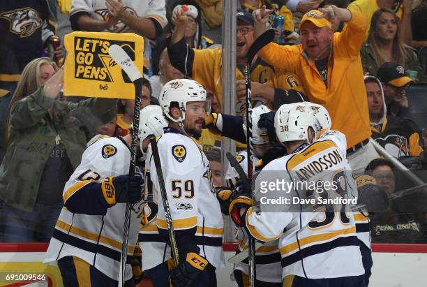 Roman Josi of the Nashville Predators celebrates with teammate Pontus Aberg after Aberg's first period goal in Game Two of the 2017 NHL Stanley Cup...