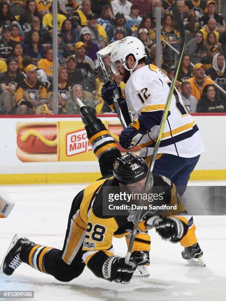 Mike Fisher of the Nashville Predators gets called for interference on Ian Cole of the Pittsburgh Penguins during the first period of Game Two of the...