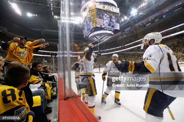 Mike Fisher of the Nashville Predators celebrates with teammates after Pontus Aberg scored a first period goal in Game Two of the 2017 NHL Stanley...