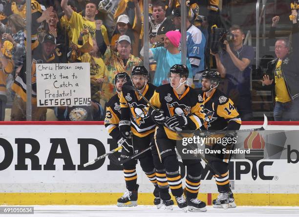 Jake Guentzel of the Pittsburgh Penguins celebrates his goal with teammates during the first period of Game Two of the 2017 NHL Stanley Cup Final...