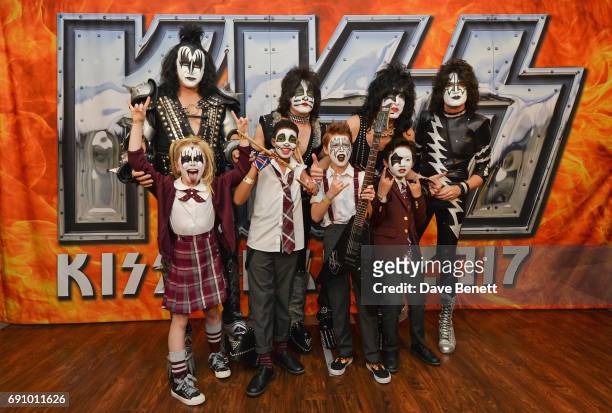 Gene Simmons, Eric Singer, Paul Stanley and Tommy Thayer of KISS pose with "School Of Rock: The Musical" cast members Eliza Cowdery, Bailey Cassell,...
