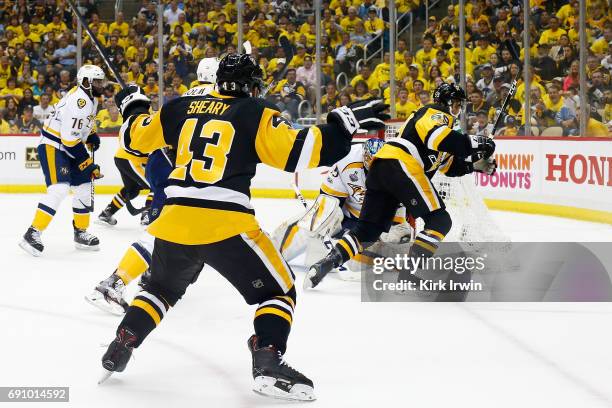 Conor Sheary of the Pittsburgh Penguins reacts after Jake Guentzel scores a goal past Pekka Rinne of the Nashville Predators during the first period...