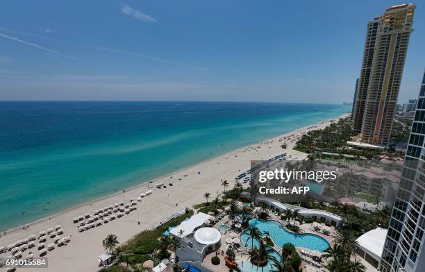 General view from a balcony of the Trump Palace luxury condominiums on Sunny Isles Beach, Florida, on May 15, 2017. - More than half, 54 percent, of...