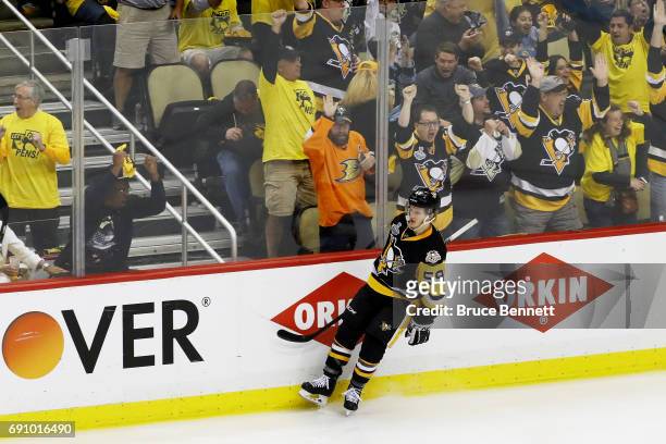 Jake Guentzel of the Pittsburgh Penguins reacts after scoring a goal during the third period in Game Two of the 2017 NHL Stanley Cup Final against...
