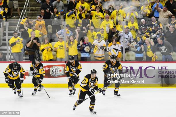 The Pittsburgh Penguins celebrate after a goal by Phil Kessel during the third period in Game Two of the 2017 NHL Stanley Cup Final against the...