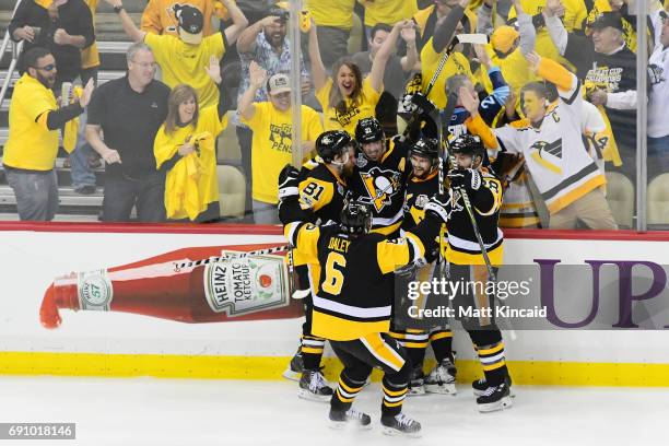 Phil Kessel of the Pittsburgh Penguins celebrates with teammates after scoring a goal during the third period in Game Two of the 2017 NHL Stanley Cup...