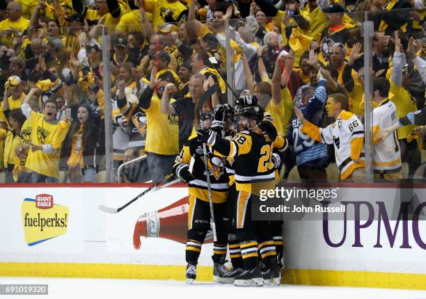 Fans cheer as Evgeni Malkin of the Pittsburgh Penguins celebrates his goal with teammates during the third period of Game Two of the 2017 NHL Stanley...