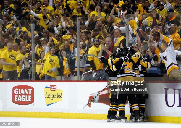 Fans cheer as Evgeni Malkin of the Pittsburgh Penguins celebrates his goal with teammates during the third period of Game Two of the 2017 NHL Stanley...