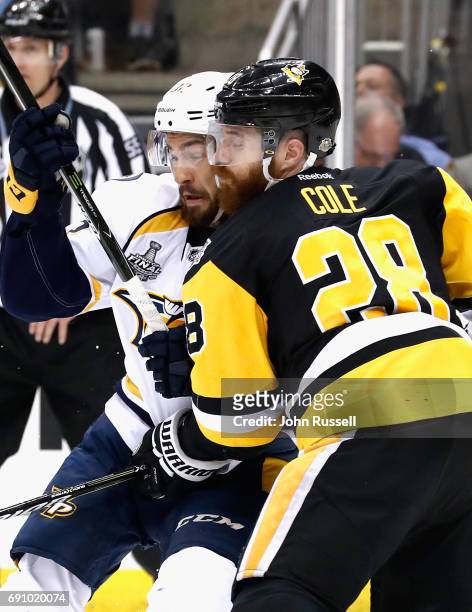 Frederick Gaudreau of the Nashville Predators and Ian Cole of the Pittsburgh Penguins battle during the first period of Game Two of the 2017 NHL...