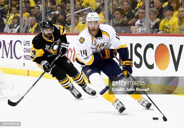 Mattias Ekholm of the Nashville Predators skates away from Justin Schultz of the Pittsburgh Penguins during the first period of Game Two of the 2017...