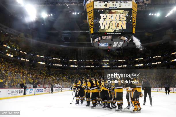 The Pittsburgh Penguins celebrate after defeating the Nashville Predators 4-1 in Game Two of the 2017 NHL Stanley Cup Final at PPG Paints Arena on...