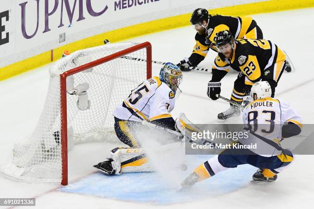 Scott Wilson of the Pittsburgh Penguins scores a goal past Pekka Rinne of the Nashville Predators during the third period in Game Two of the 2017 NHL...
