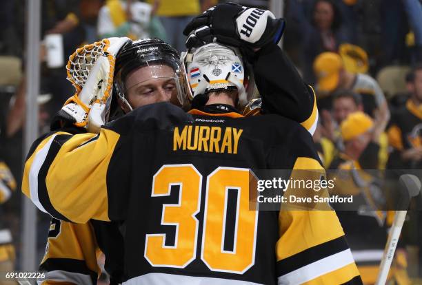 Ian Cole of the Pittsburgh Penguins congratulates goaltender Matt Murray after they defeated the Nashville Predators 4-1 in Game Two of the 2017 NHL...