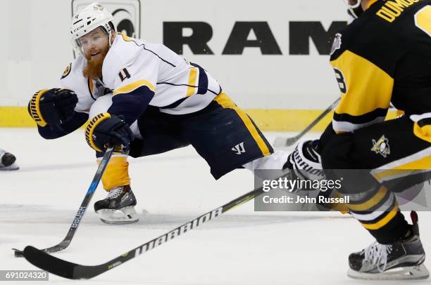 Ryan Ellis of the Nashville Predators reaches for the puck during the third period of Game Two of the 2017 NHL Stanley Cup Final against the...