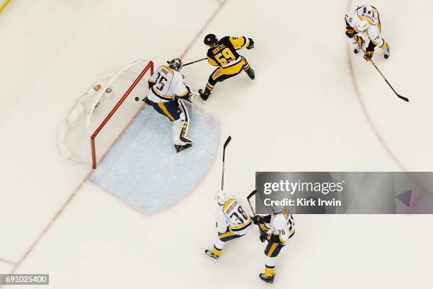 Jake Guentzel of the Pittsburgh Penguins scores a goal past Pekka Rinne of the Nashville Predators during the first period in Game Two of the 2017...