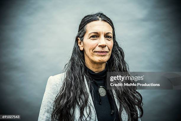 Portrait of senior woman with long hair