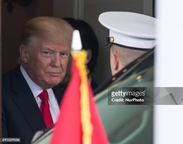 President Donald Trump walked out of the West Wing Portico of the White House, with Prime Minister Nguyen Xuan Phuc of Vietnam, after their meeting...
