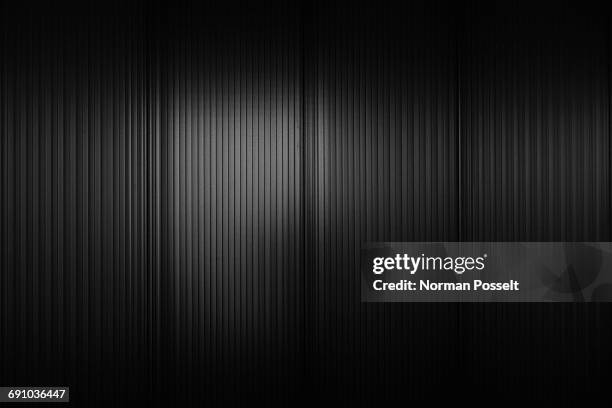 full frame shot of black corrugated wall - schwarz stock-fotos und bilder