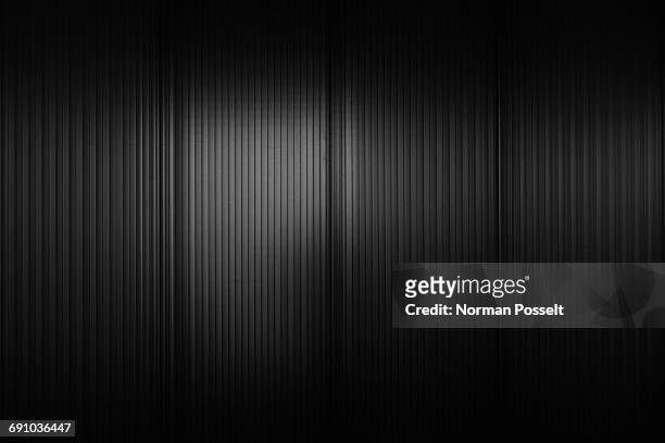 full frame shot of black corrugated wall - colore nero foto e immagini stock