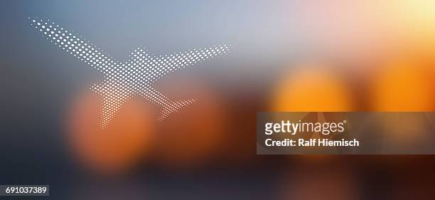 spot patterned airplane over soft defocused background - commercial airplane stock illustrations