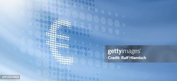 close-up of spotted euro symbol over blue background - euro symbol stock-grafiken, -clipart, -cartoons und -symbole