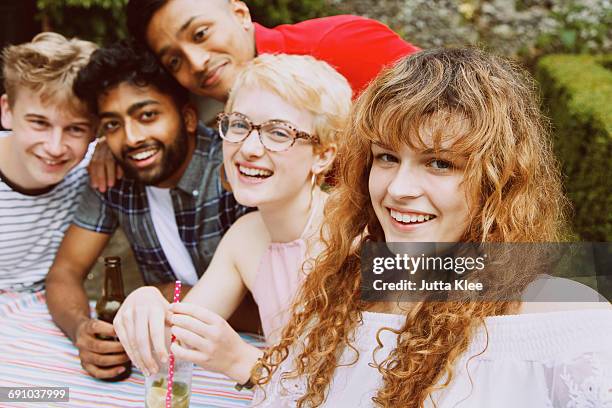 portrait of happy friends enjoying party at yard - curly bangs stock pictures, royalty-free photos & images