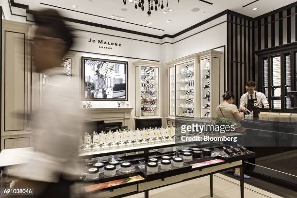 Sales assistant serves a customer at a Jo Malone Ltd. Store in the Raffles City shopping mall in Shanghai, China, on Wednesday, May 31, 2017....