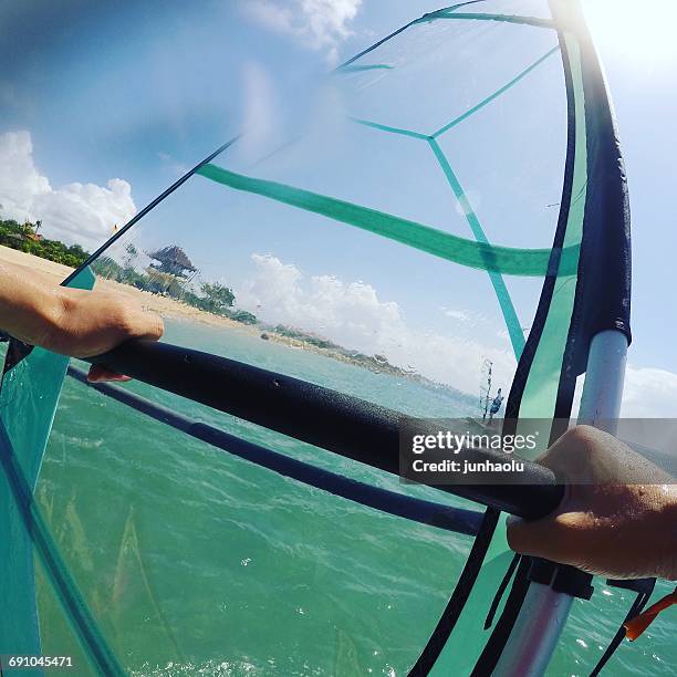 man windsurfing, bali, indonesia - windsurfers stock pictures, royalty-free photos & images