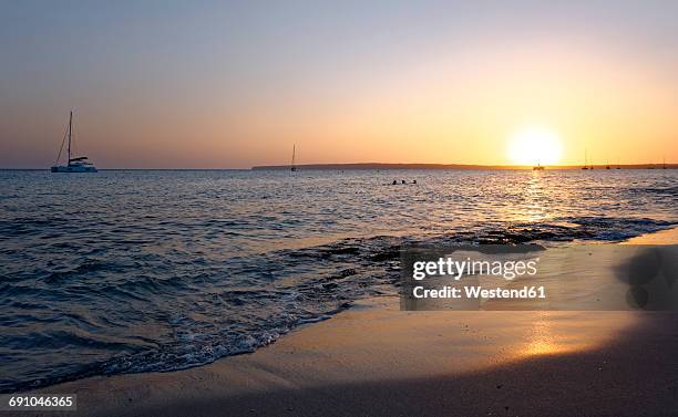 spain, formentera, sunset at playa de migjorn - insel formentera stock-fotos und bilder